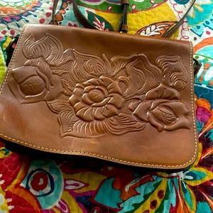 Tooled leather bag.